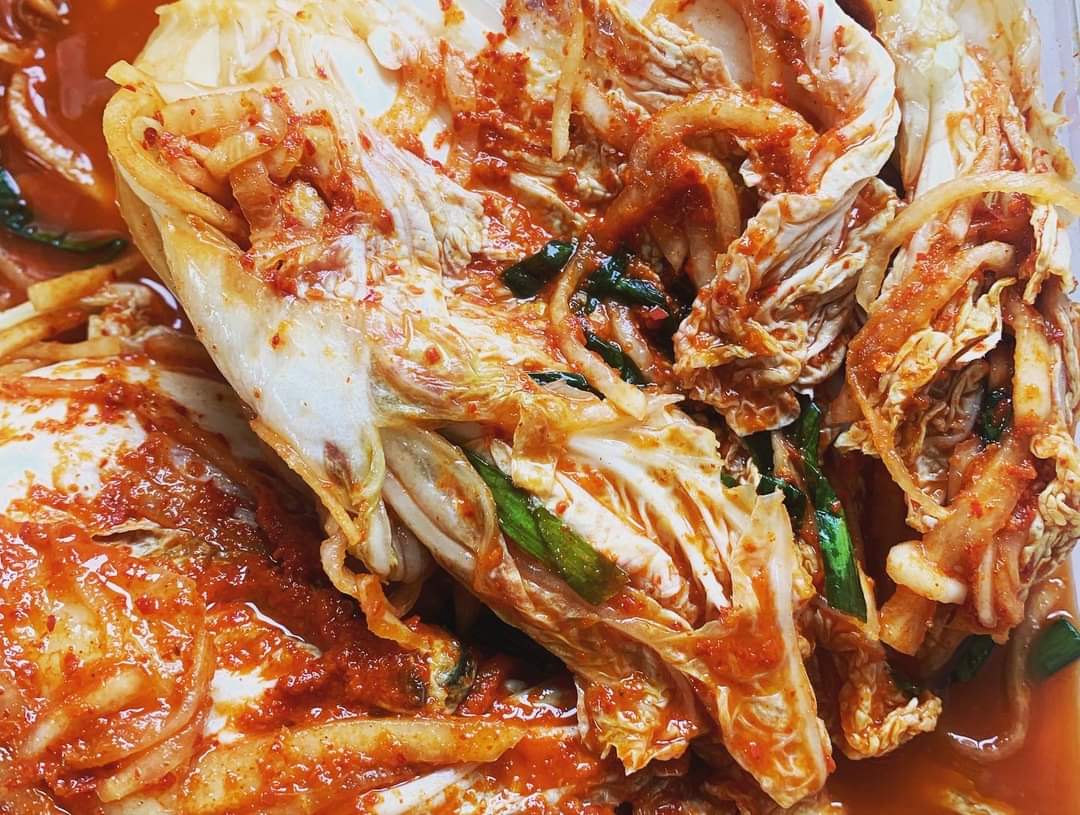 Freshly made baechu kimchi, napa cabbage in red chilli seasoning