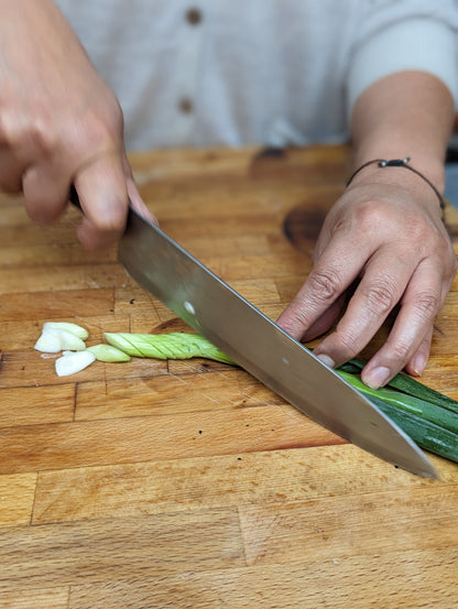 Slicing spring onions in a Korean cooking class